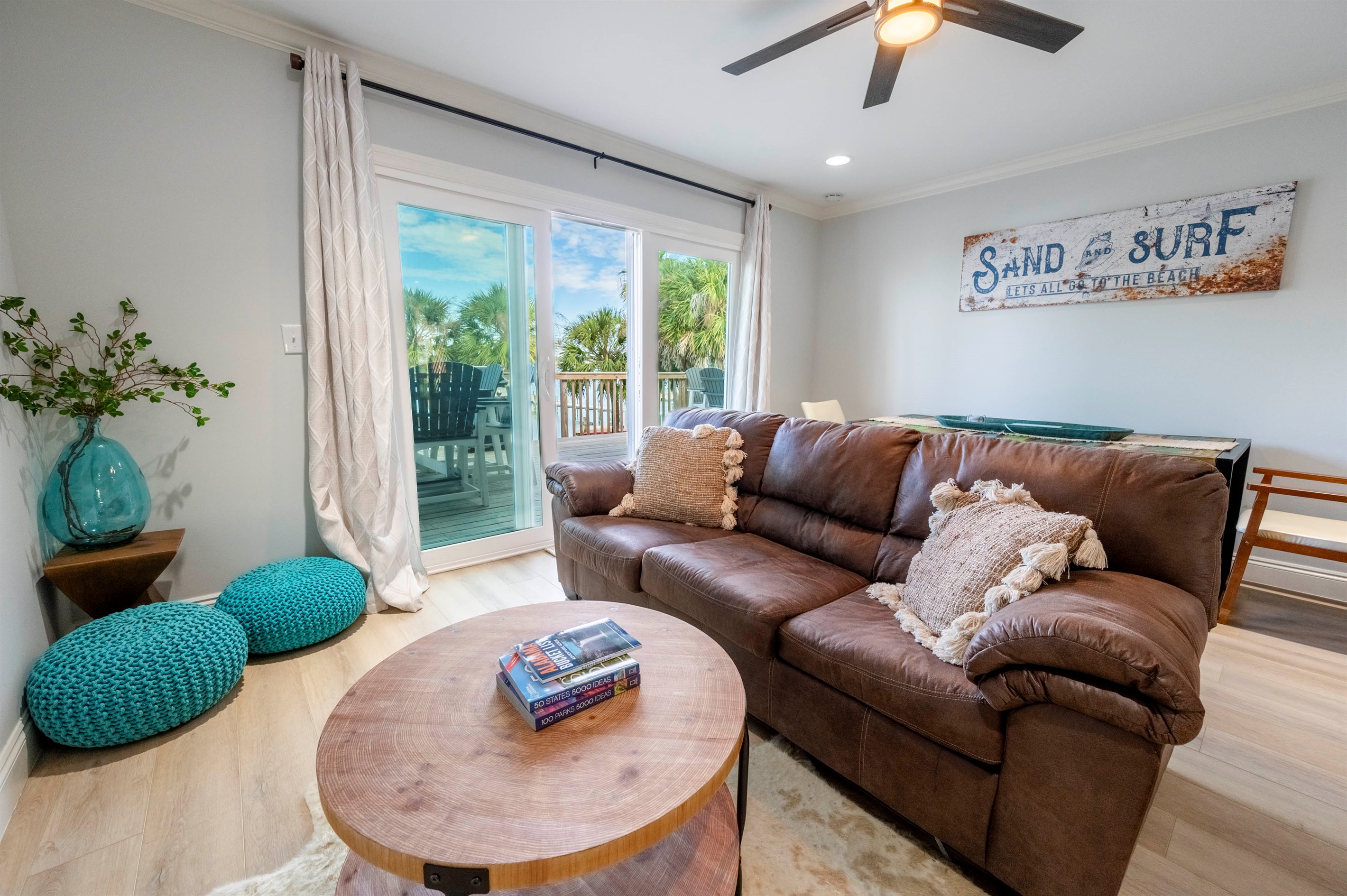 Beachy relaxation: Cozy living room with ocean views and charming decor vibes!