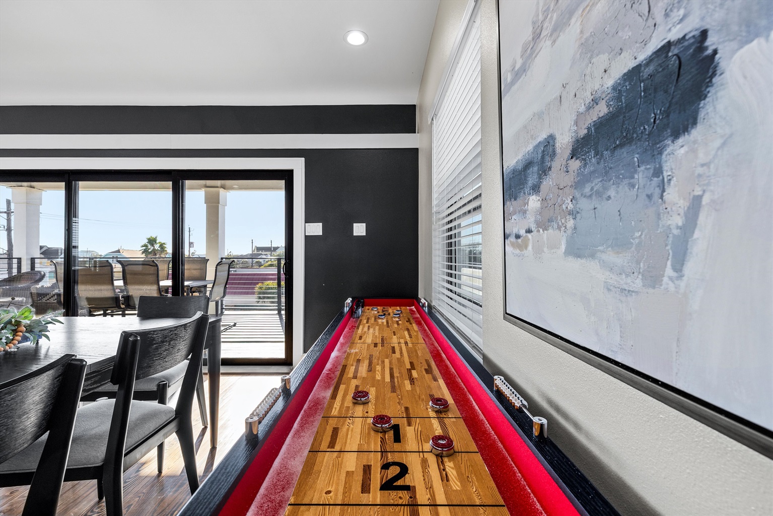 Game Room: Challenge friends to a fun game night in this vibrant space with ocean views!