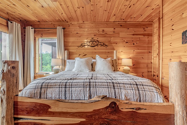 Primary suite with rustic King log bed.