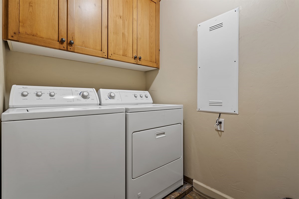 Laundry room with washer and dryer for extended stays