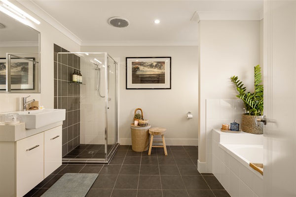 Generously proportioned Master en-suite with full bath, separate shower and double vanity.