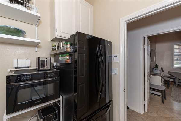 Full-size refrigerator and microwave convection oven in kitchenette