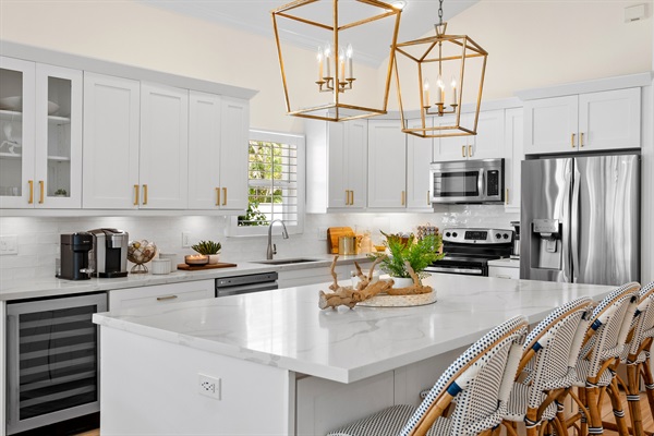 Fully Stocked Kitchen w/ Bar Seating and Two Tables!