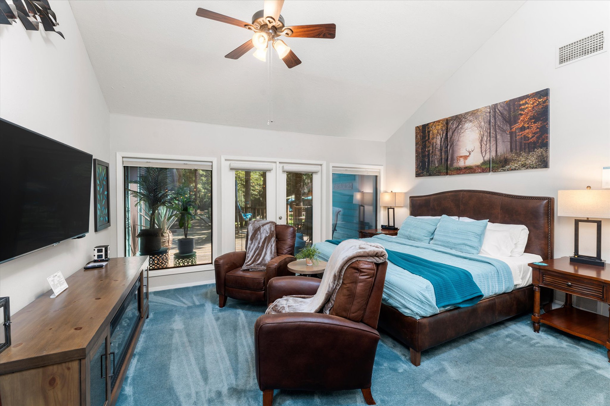 The Skylight Room. (King Suite 2) with a king bed and easy access to the patio.