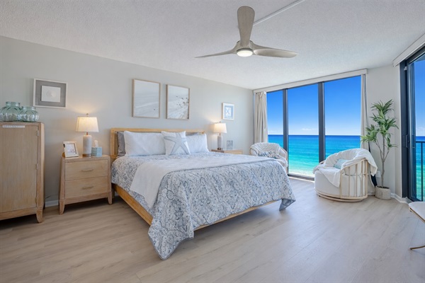 Relax in coastal luxury—this master bedroom offers serene ocean views and the soothing sound of waves, perfect for a peaceful beach getaway