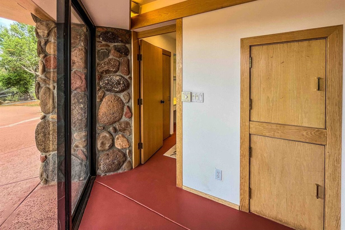 Glass doors fully open to pool patio 