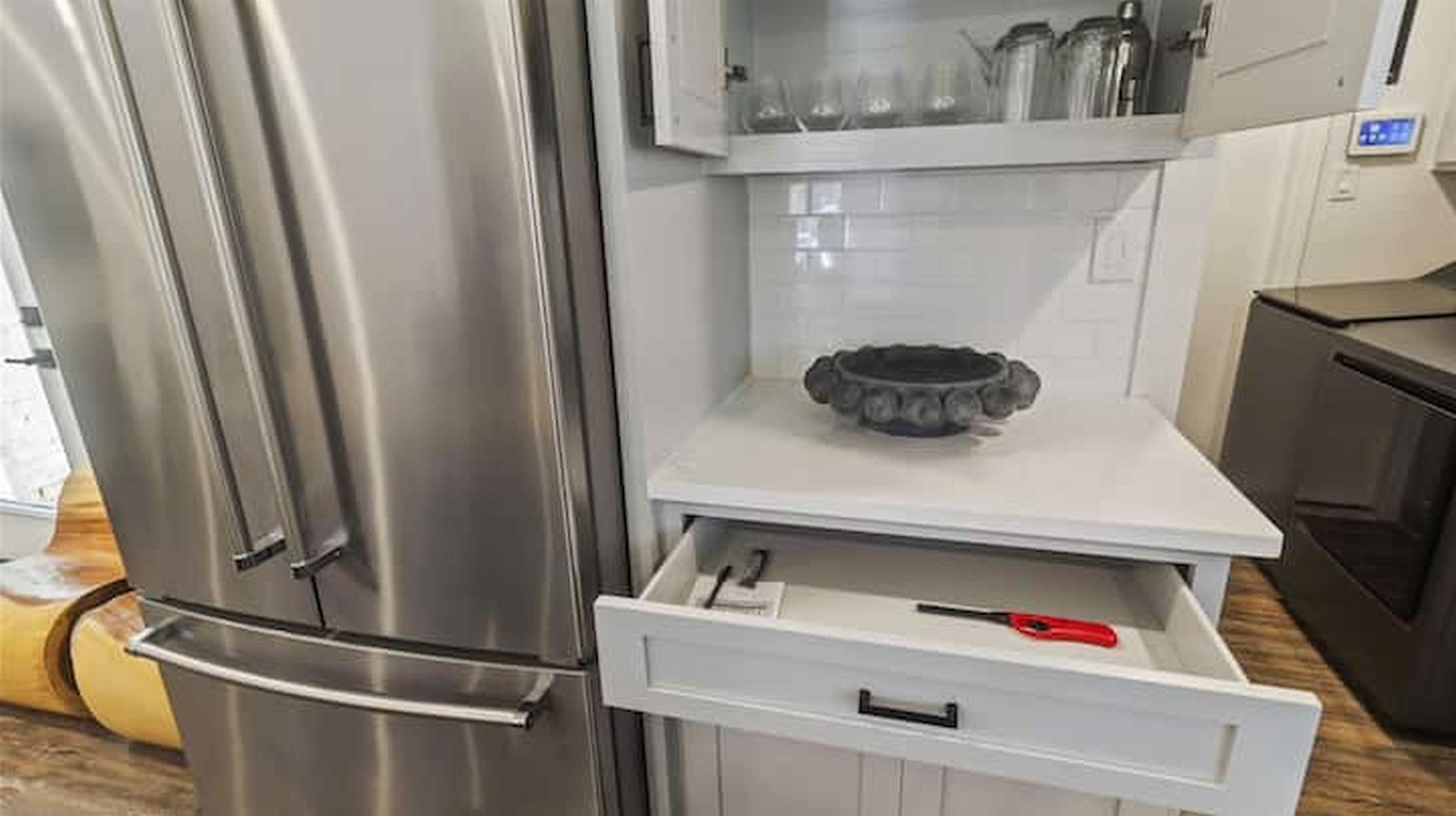 Modern kitchen details with stainless steel appliances and thoughtfully stocked essentials.