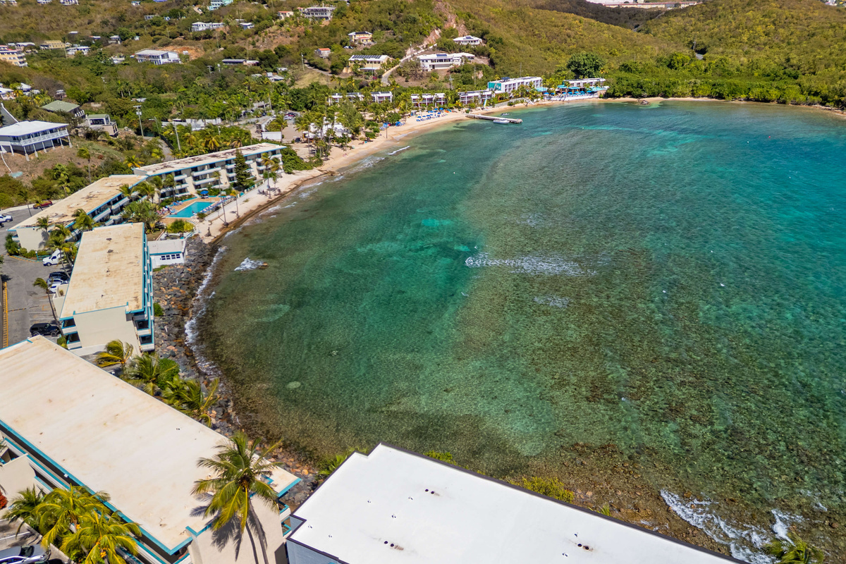 See the beauty of the resort from above, surrounded by turquoise water.