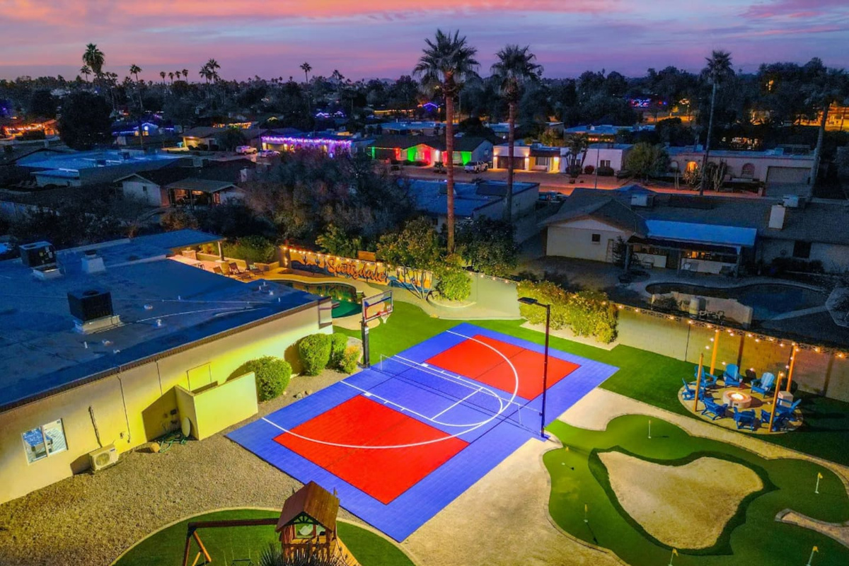 The sport court takes center stage as the sky turns pink — built for competitive games that run late into the evening.
