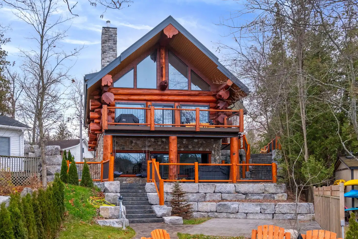 Waterfront side of Bear Lodge with decks and outdoor living spaces