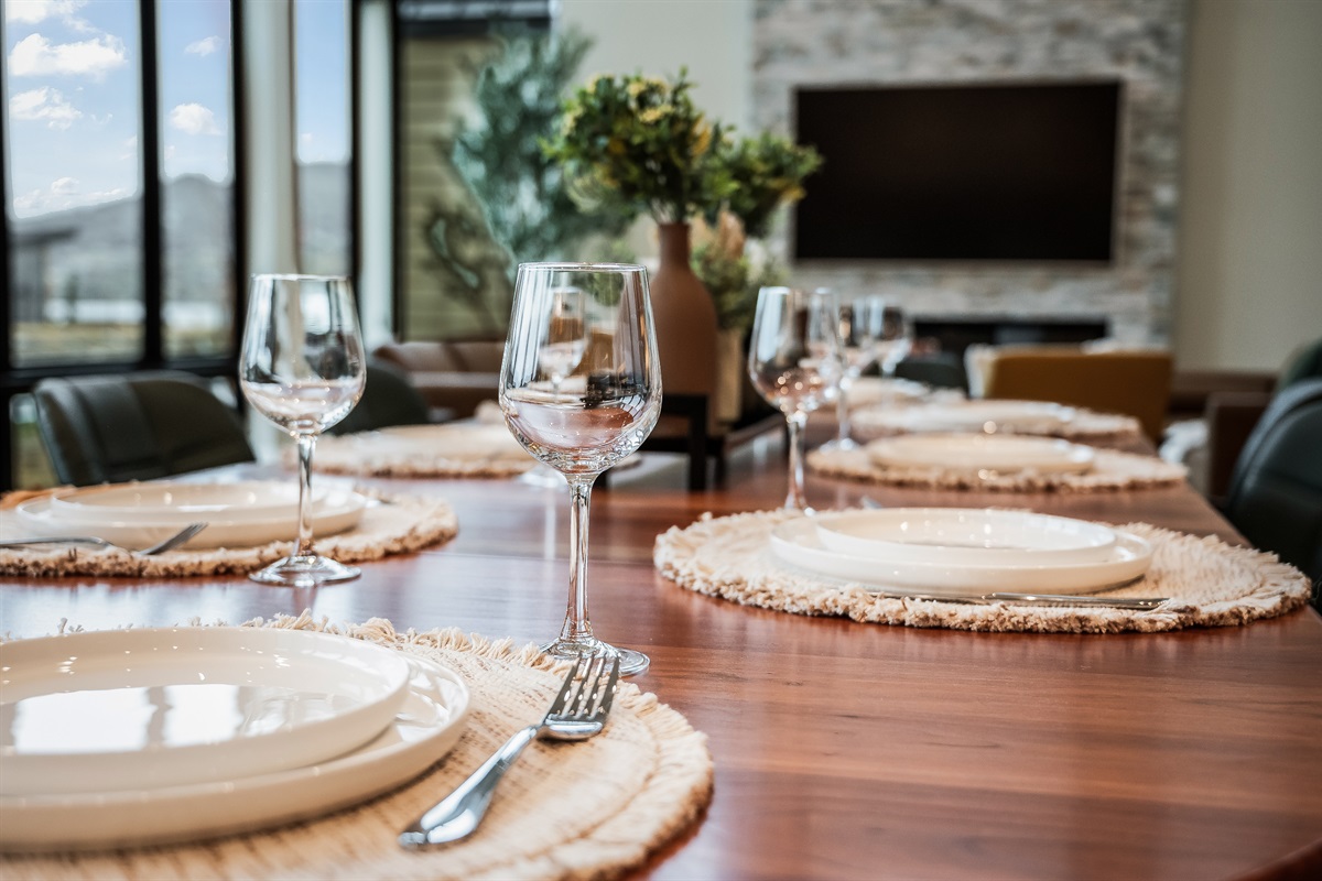 Dining table has several extendable leaves and extra chairs to seat up to 12.