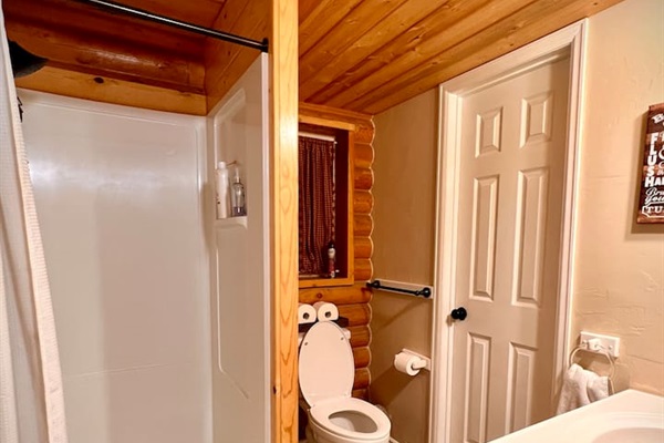 Centrally located to the entire cabin is this 3/4 bath on the main floor.