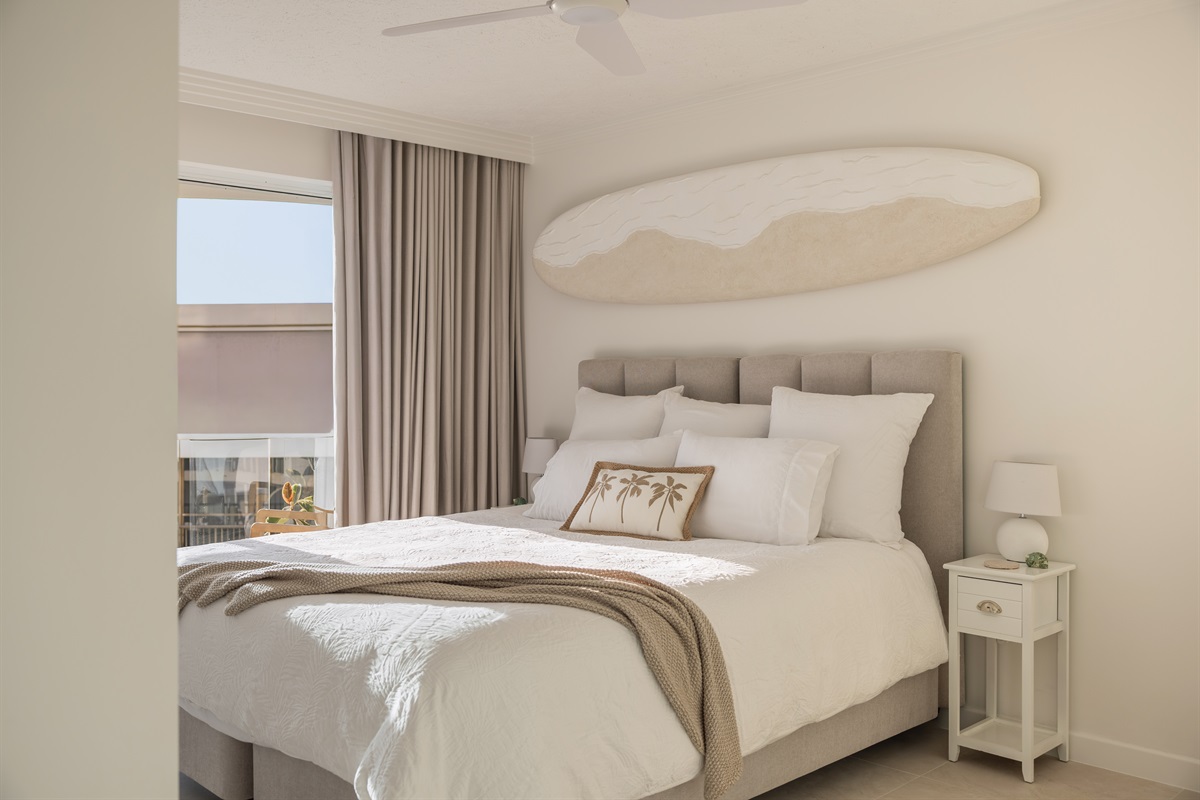 Cosy king bed with coastal styling - easily reconfigured into 2 long singles when needed.