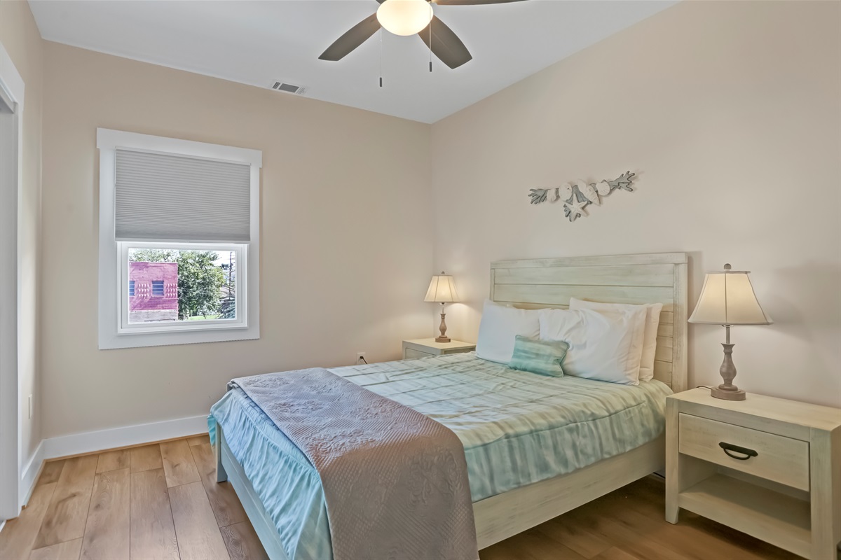Bright and inviting, the second bedroom offers a comfortable place to unwind.