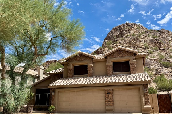 Front of house with mountain in the back