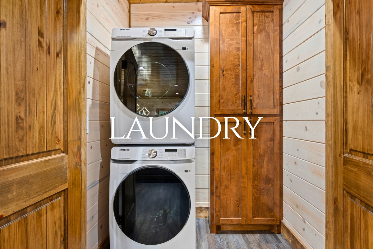 The laundry area includes a stacked washer and dryer, making it easy to keep up with laundry during longer stays or after outdoor adventures.