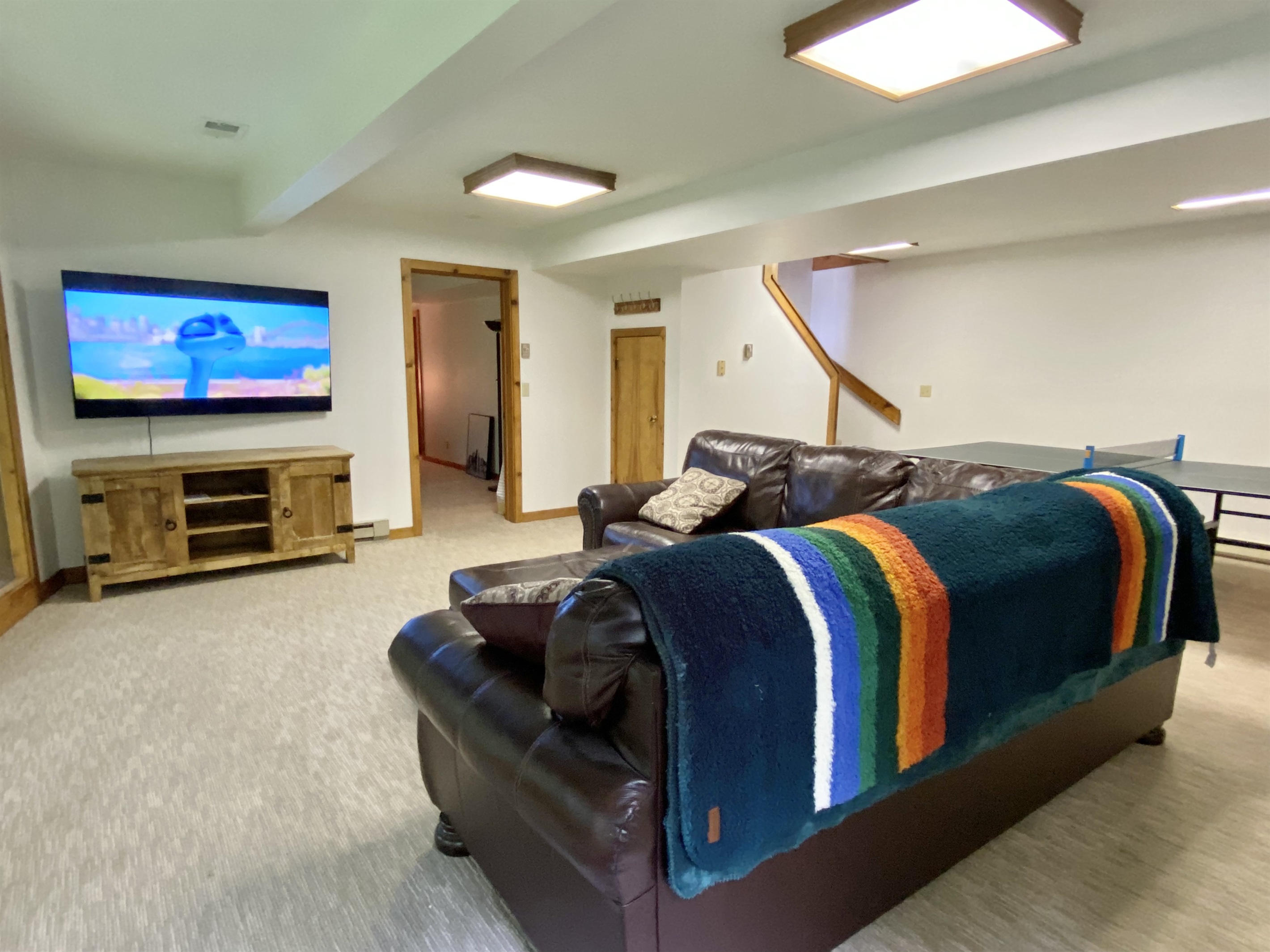 Basement with a 65 smart TV perfect forr the kids or game days.