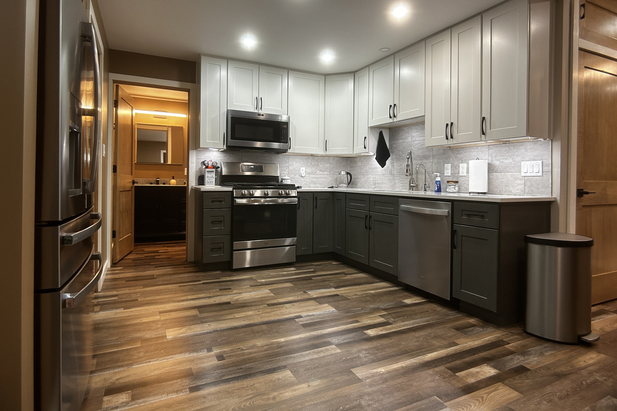 Amply stocked kitchen with quartz counters. Reverse osmosis water faucet located at sink. Refrigerator with a beverage drawer. Pantry space for your items.