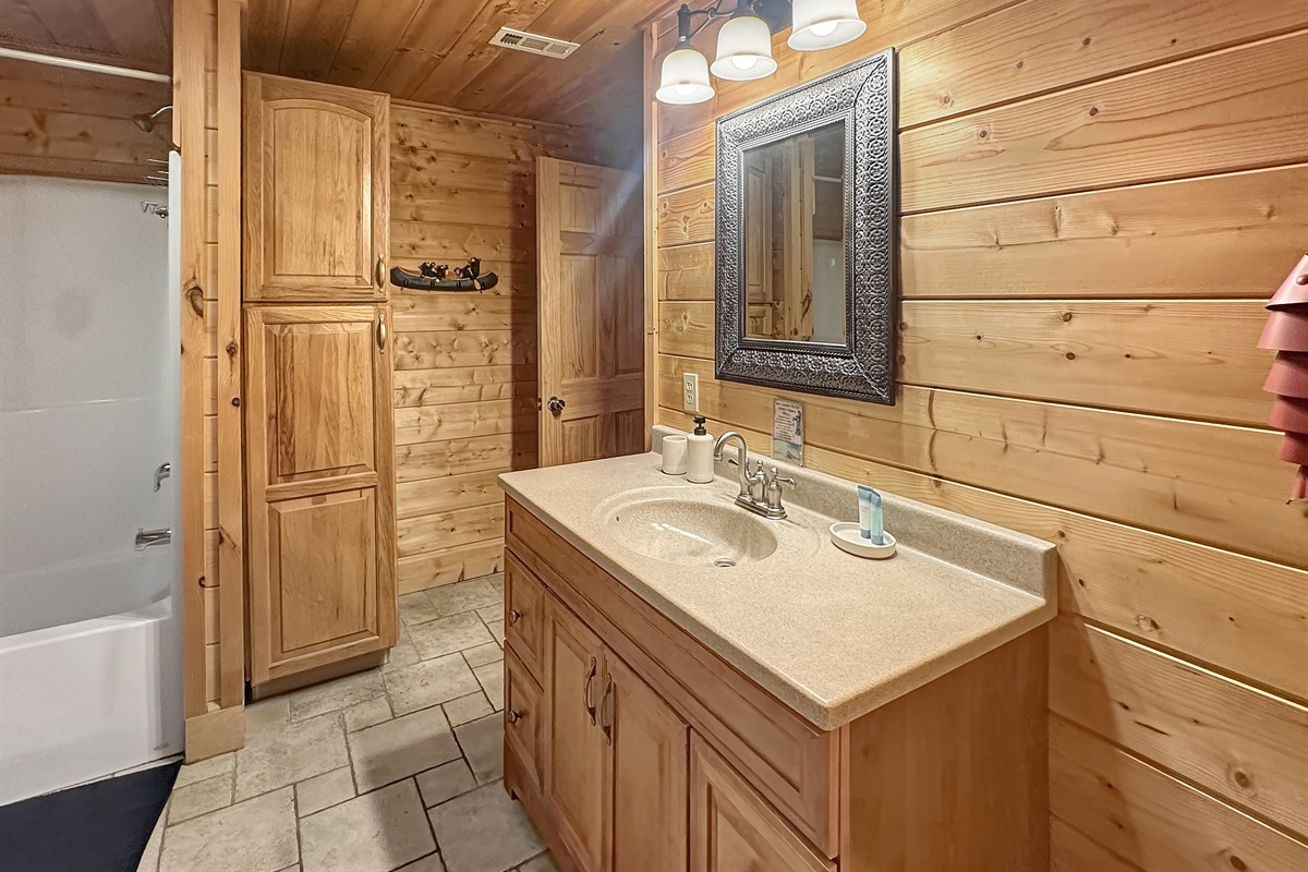 Bathroom: Experience rustic elegance with wood accents and modern amenities!
