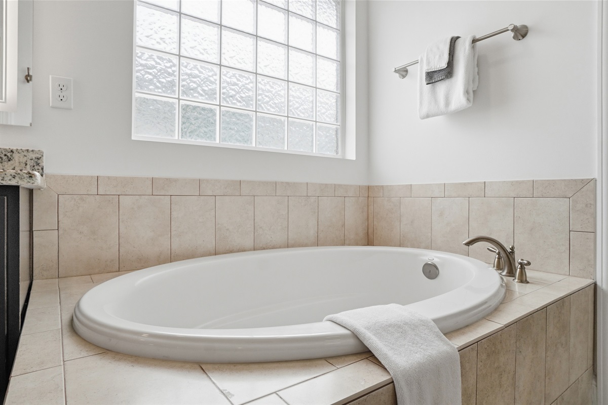 soak all of your worries away in this master bathtub