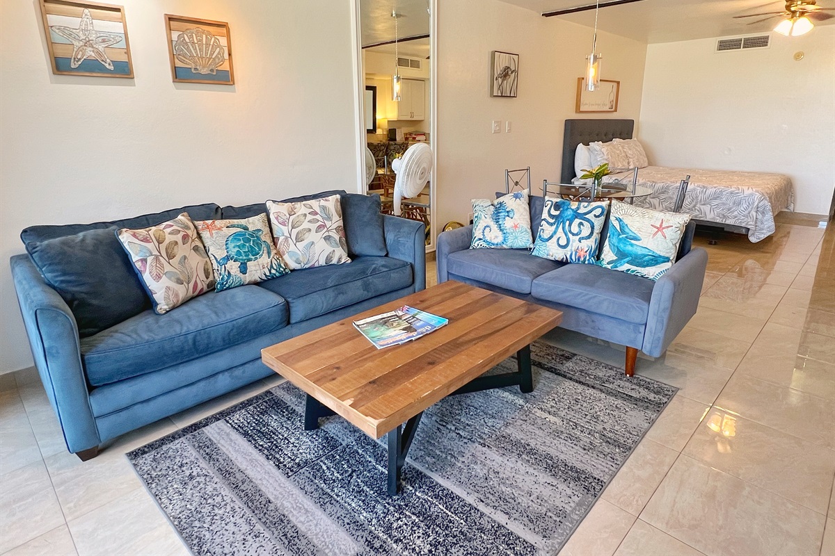 Ample seating in the living room ensures everyone has a cozy spot.