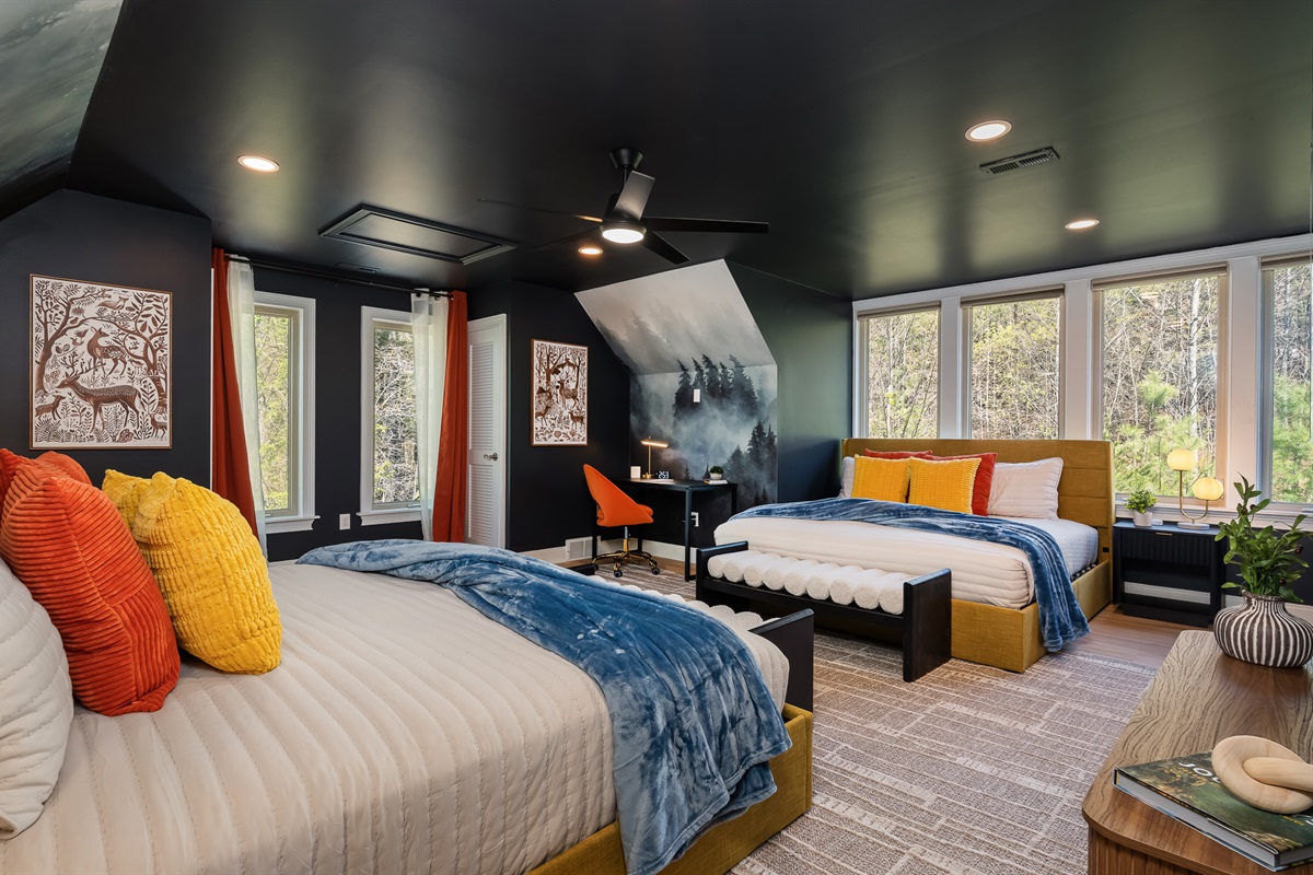 Expansive bedroom with two beds and workspace - plenty of room to spread out and unwind