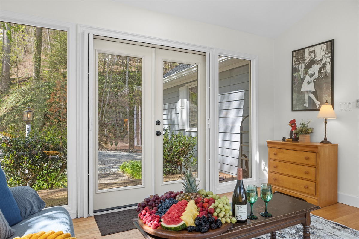 Sun Room: Bright and inviting space welcomes you with fresh fruit, wine, and nature's beauty!