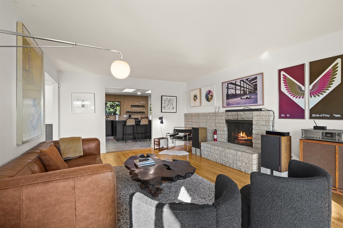 Gather and unwind in the spacious living room featuring comfortable seating, a Smart TV, and an inviting atmosphere perfect for relaxing with family and friends.