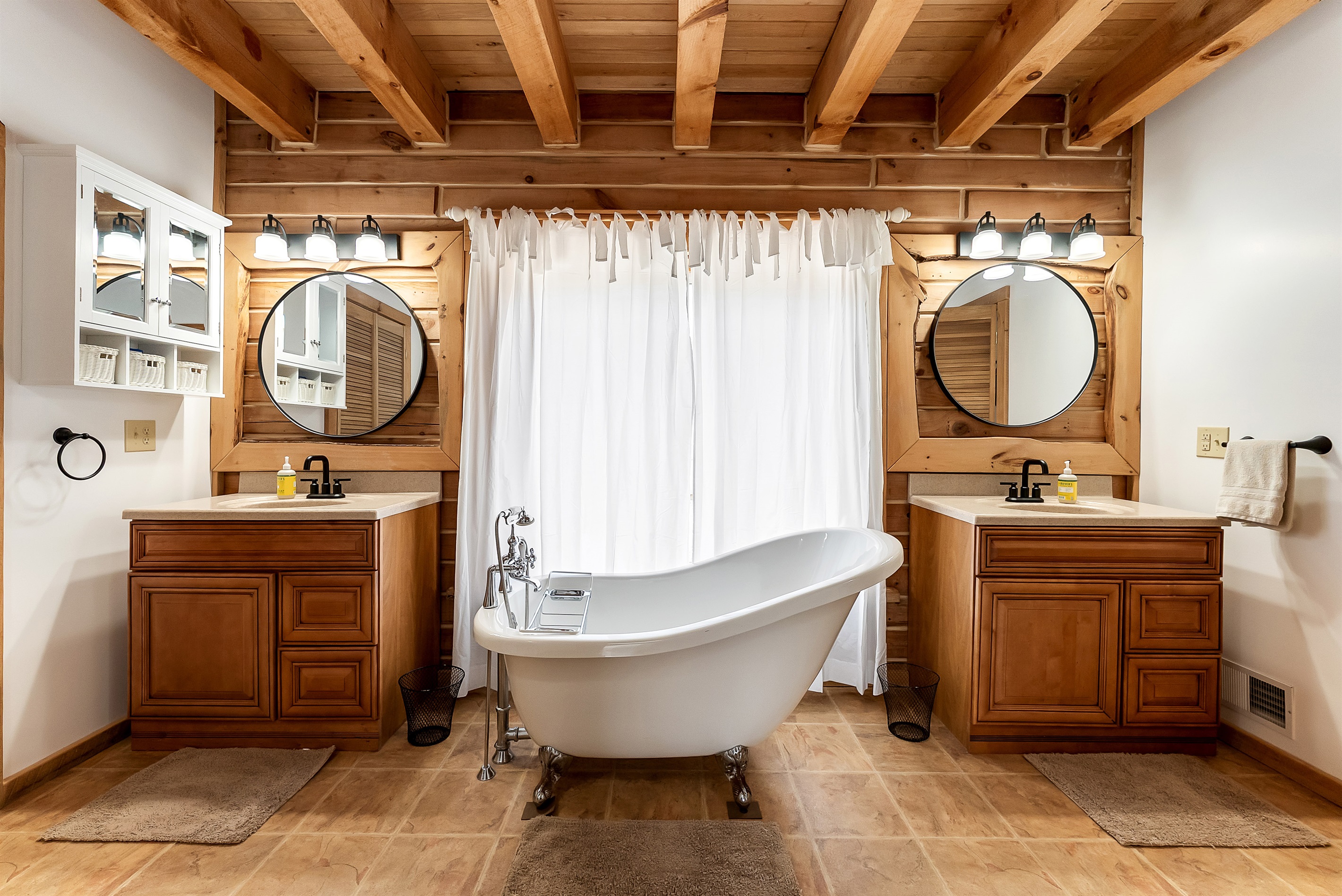 Master Bedroom with soaking tub, 2 vanities, shower and toilet. Closet is to the left and shower and toilet are to the right.