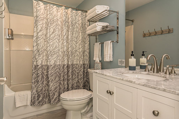 This bathroom is attached to bedroom 5. It has a tub/shower combo.