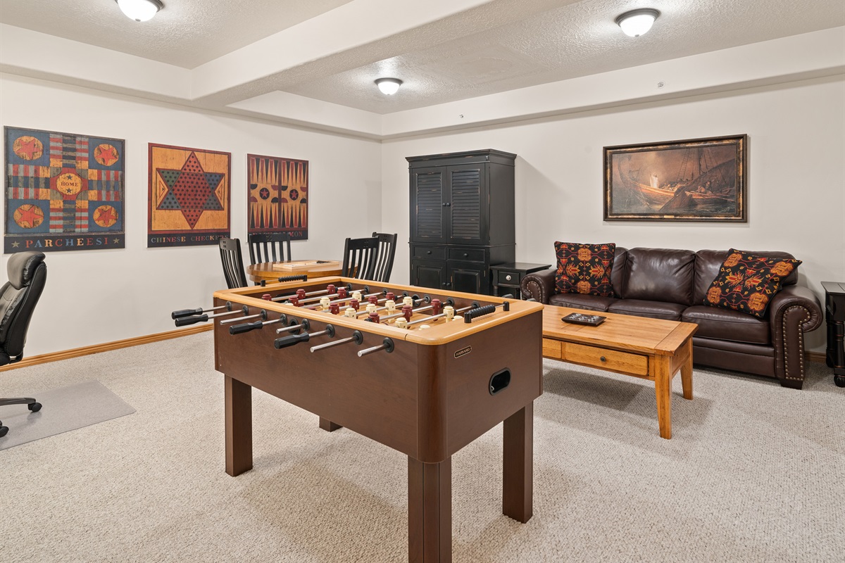Spacious game room with foosball and comfortable seating