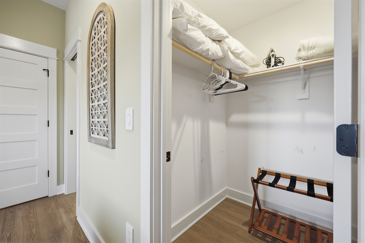King bedroom closet with plenty of storage space

