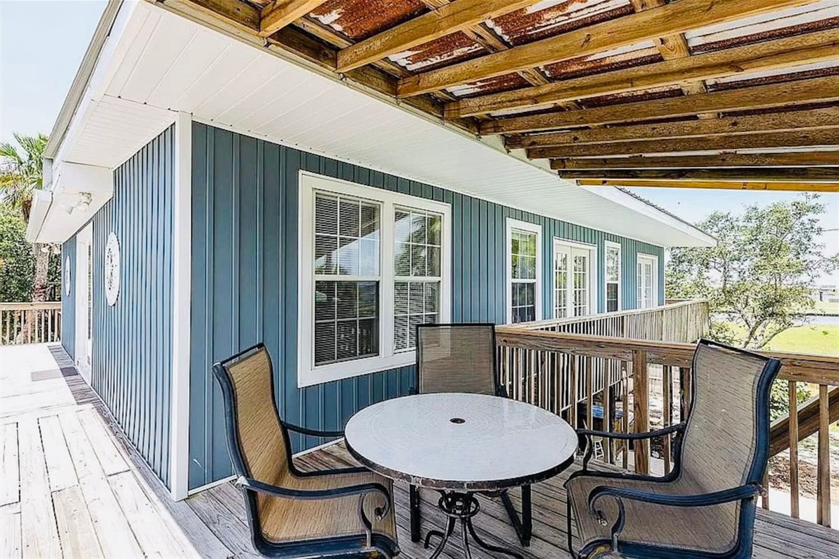 Patio Retreat: Enjoy sunny mornings and evening breezes on the spacious deck overlooking the bay!