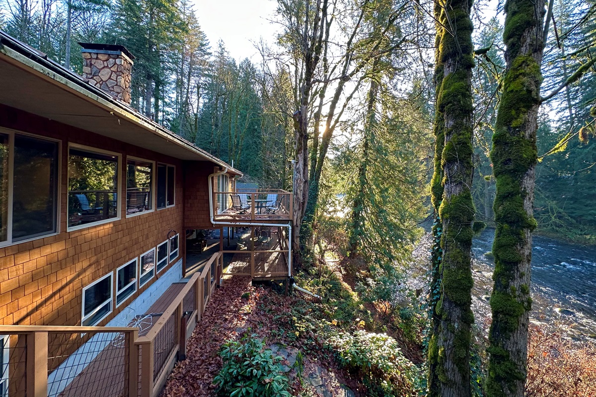 View of the Salmon River and the upper deck (off the primary upstairs), and lower deck which is off the Den & Primary downstairs