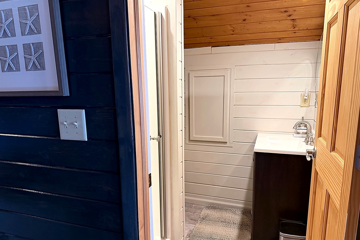 Upper-level bathroom right at the top of the stairs, conveniently located off the loft and second bedroom for easy mornings and quick refreshes.