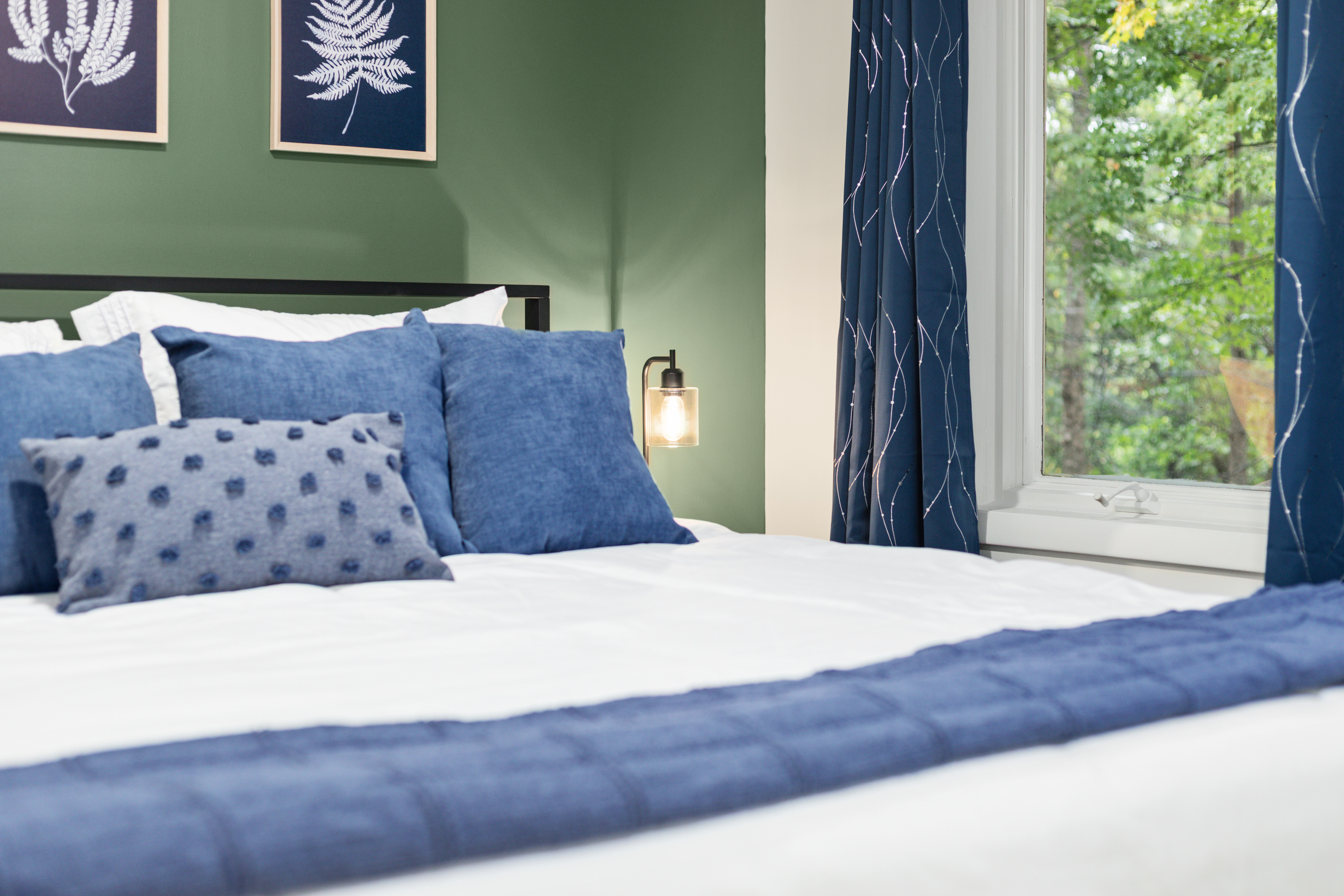 A king bed with all linens provided — soft, crisp, and ready for a restful night's sleep.