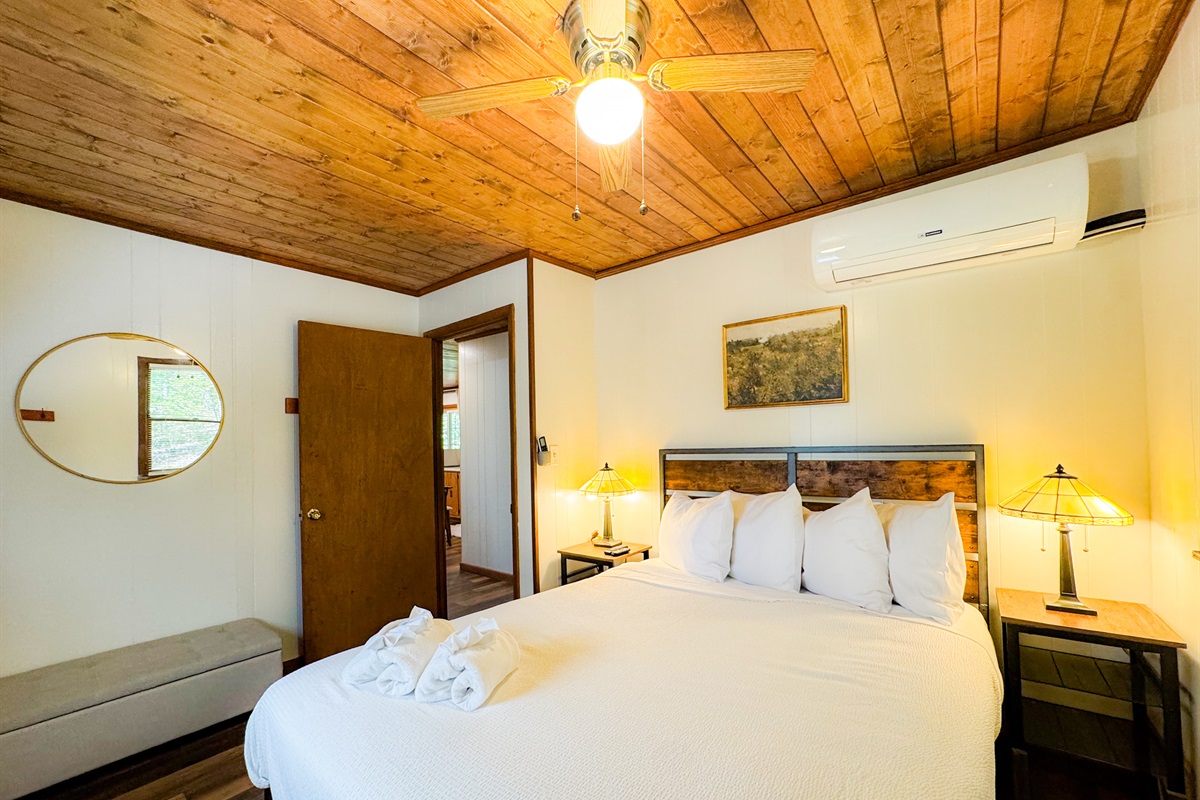 Bedroom one on the main level features a queen bed with comfy, high thread count sheets and linens.