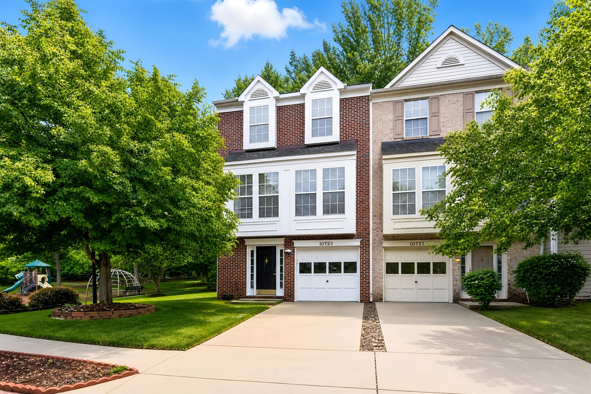 Family Townhome — Three-Story Exterior, Two-Car Driveway, Quiet Neighborhood Setting