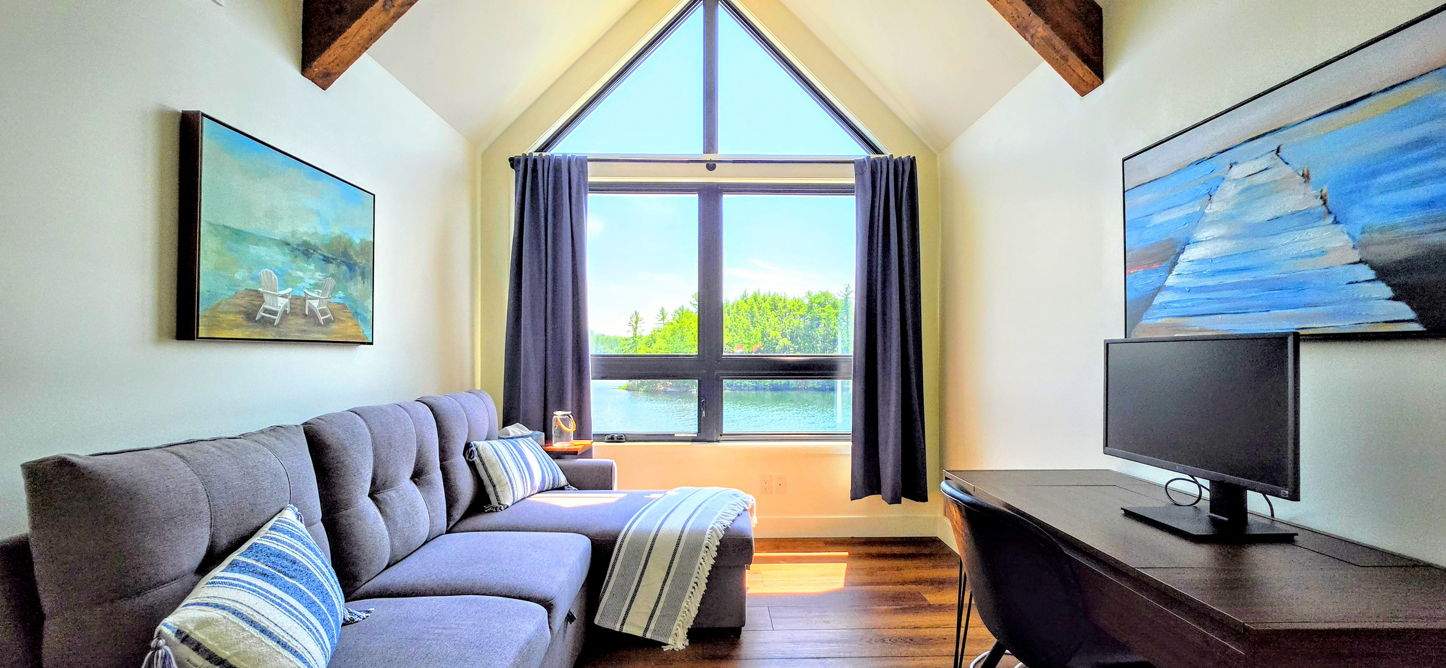 Upper floor sleeping couch and work area