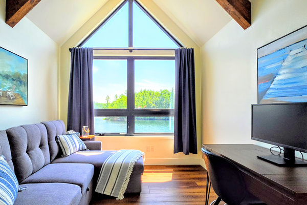 Upper floor sleeping couch and work area