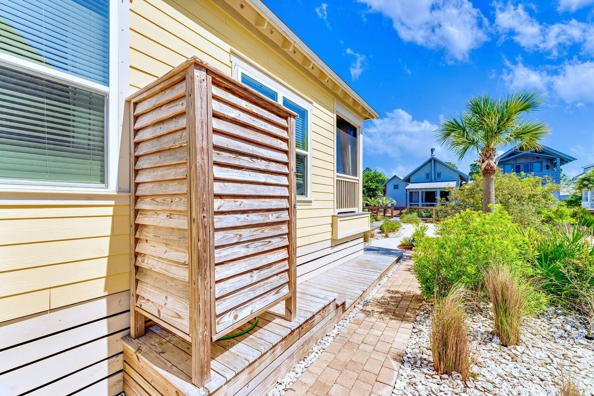 Convenient outdoor shower makes it easy to wash away the sand before heading inside