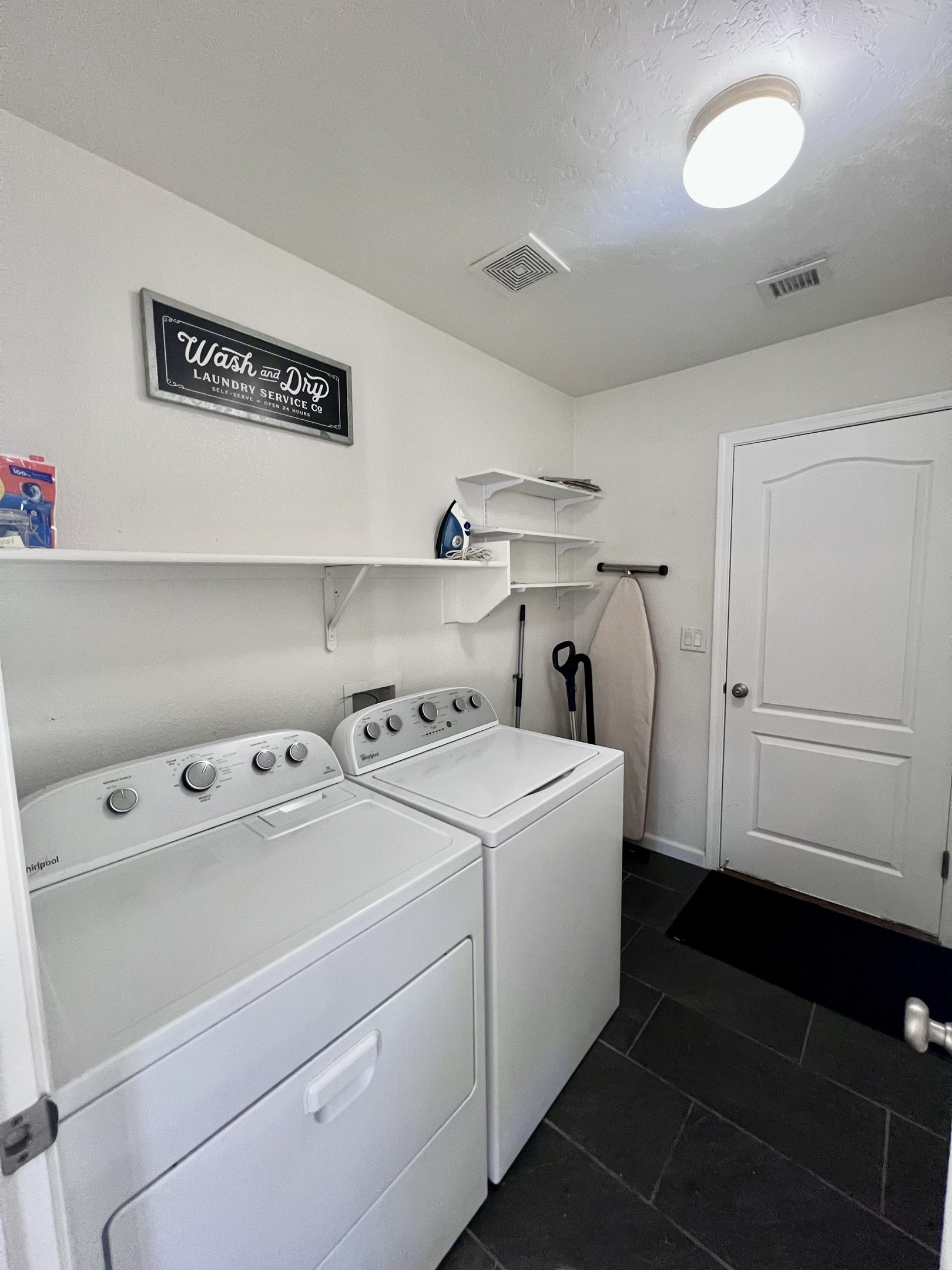 Enjoy the convenience of a private laundry room with a full-size washer and dryer