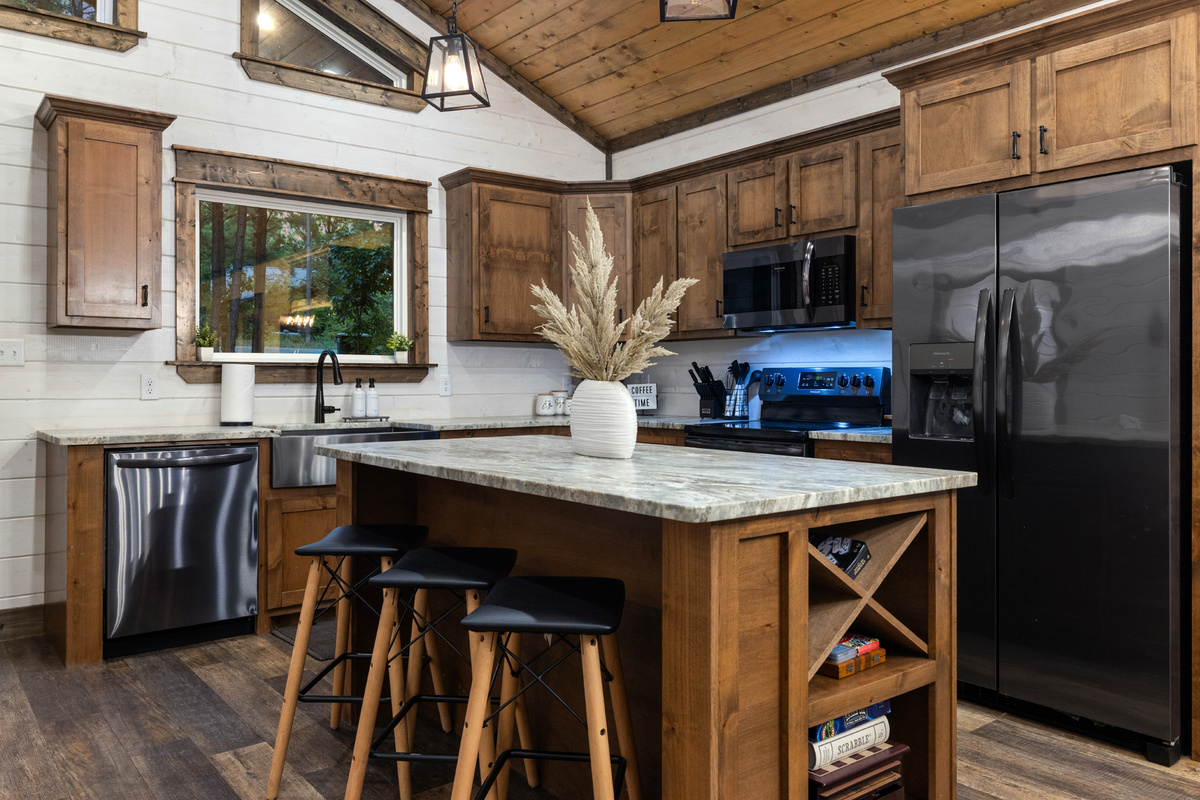 Fully equipped for more than takeout. Past guests have loved cooking here, with plenty of space to prep meals and a peaceful view of the pines ad forest while you do it.