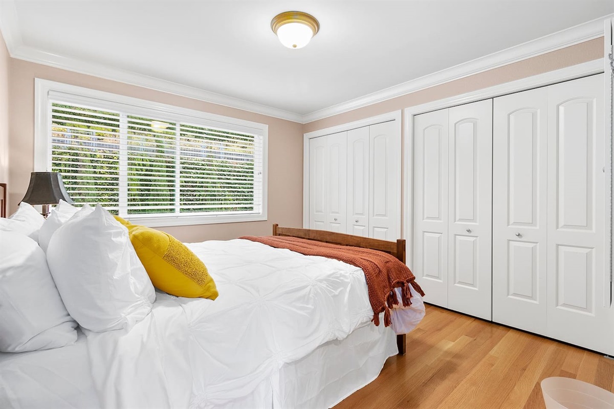 3rd bedroom with queen bed and ample closet space