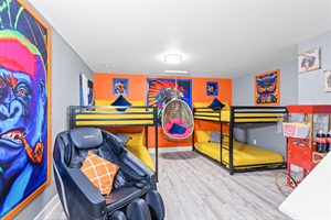 Bedroom 4 offers 4 cozy bunk beds, striking artwork, a relaxing massage chair, and a popcorn machine—perfect for a playful and relaxing stay!