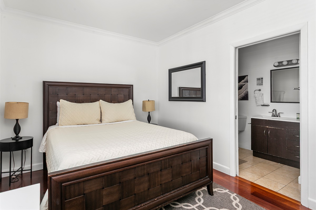 Guest Suite with en-suite bath, closet storage, and room-darkening curtains