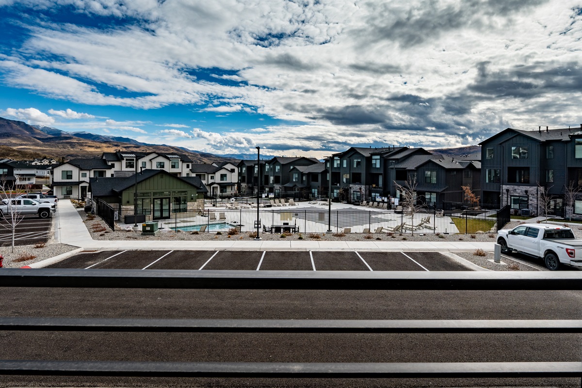 Deck views overlooking community amenities and mountains.