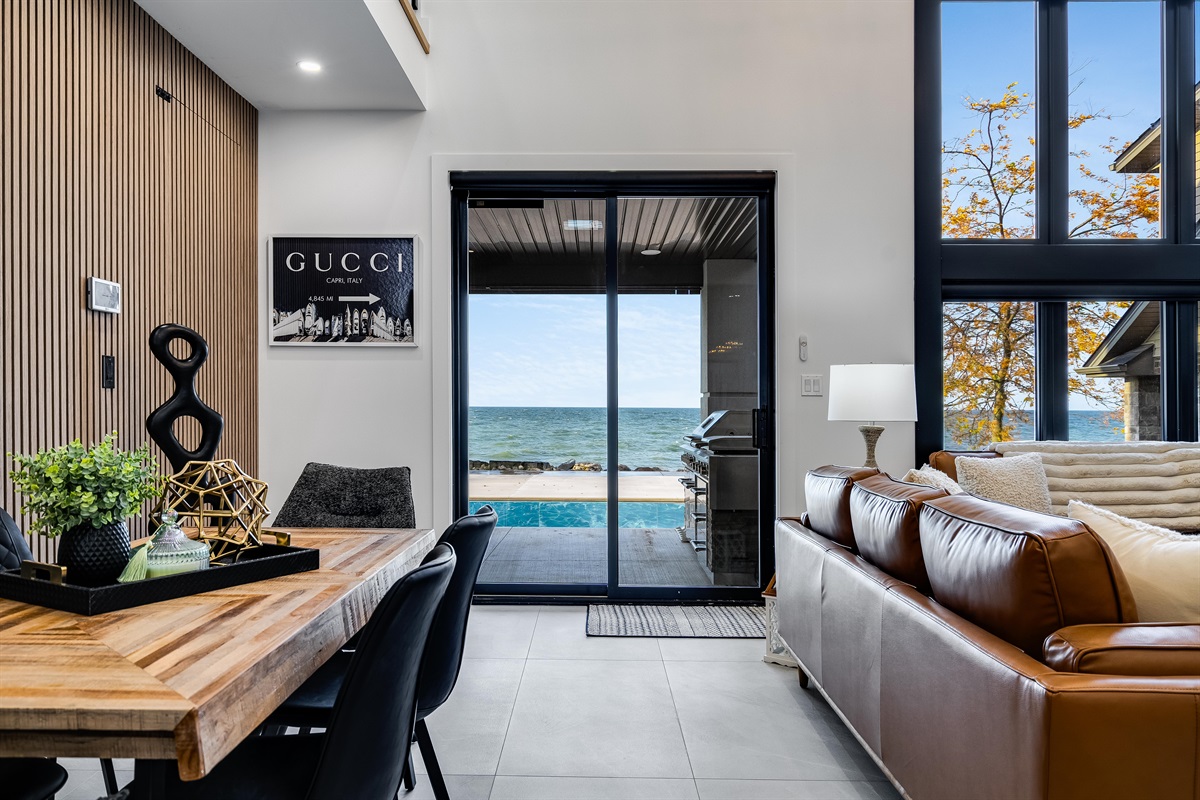 Open concept living and dining area with lake views.