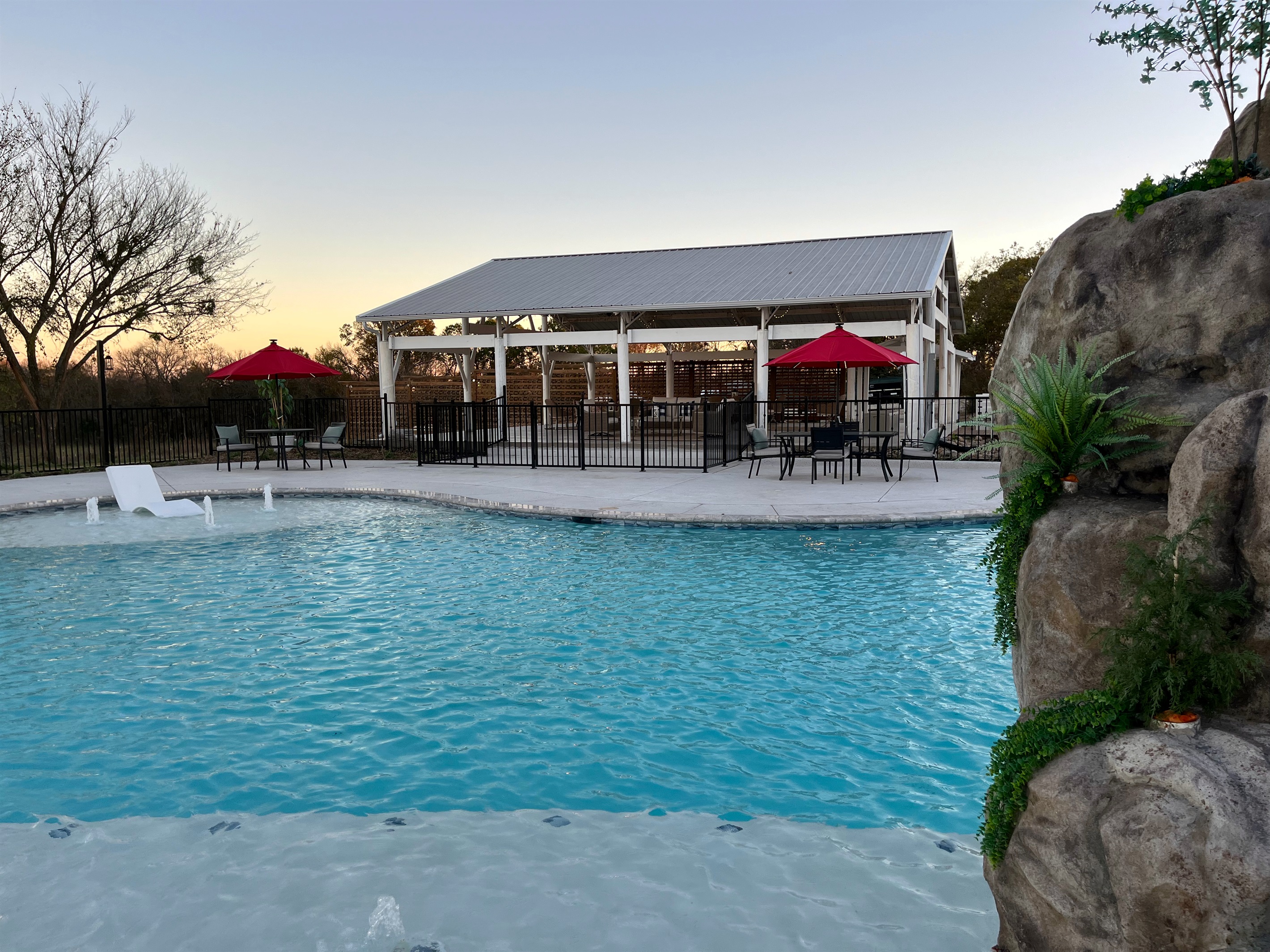 Resort style 30,000-gallon saltwater pool with double waterfalls and grotto and slide