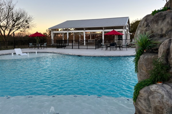 Resort style 30,000-gallon saltwater pool with double waterfalls and grotto and slide